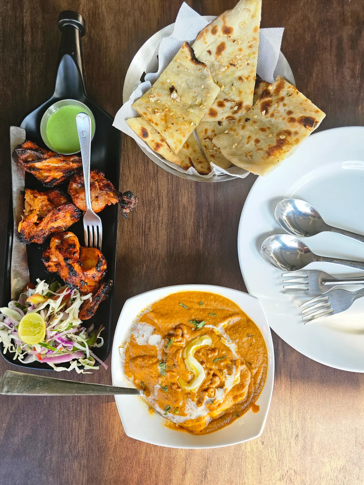 Paneer butter masala and tandoori chicken and cheese garlic naan
